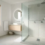 Clean sparkling shower glass door in a modern bathroom after removing hard water stains