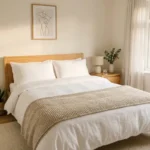 - Cleaning Tips Today Neatly made bed with clean white sheets and pillows in a sunlit bedroom, representing fresh and hygienic bedding.