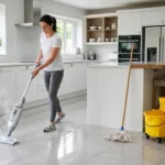 - Cleaning Tips Today Comparison of a steam mop with rising steam and a traditional mop and bucket on a clean tiled kitchen floor
